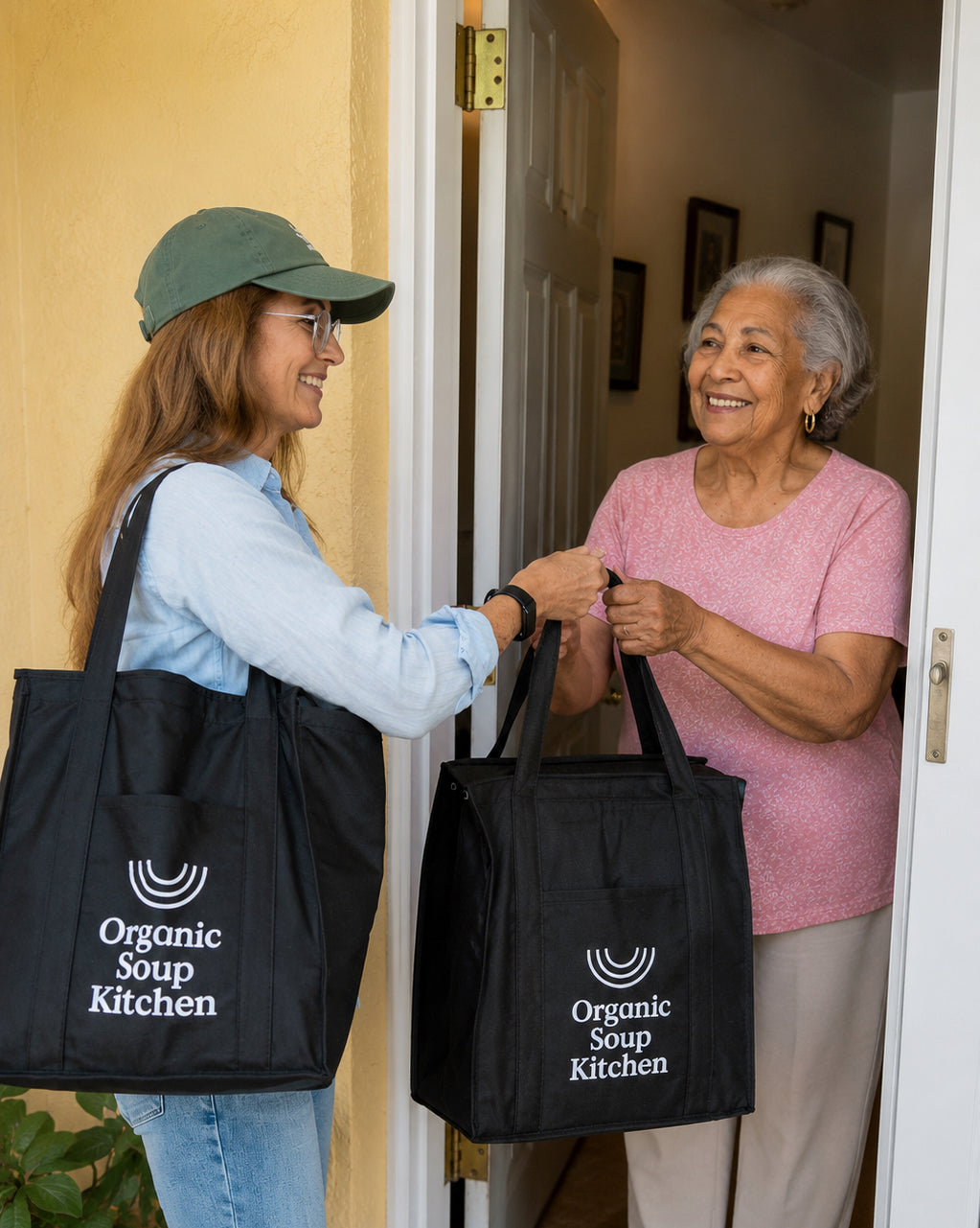 Organic Soup Kitchen volunteer delivering soup meals